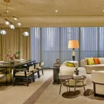 5 BHK Rustomjee Crown Prabhadevi Living Room with Dining Area and Sofas