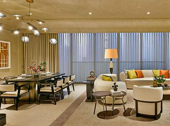 5 BHK Rustomjee Crown Prabhadevi Living Room with Dining Area and Sofas