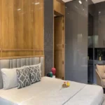 Adani Western Heights Andheri West 3 BHK Bedroom With Bed And Wooden Wall Panels