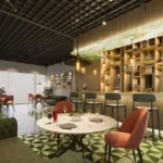 Sugee Marina Bay Worli Indoor Lounge With Round Tables Chairs Sofa Seating And Bar Counter