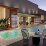 Sugee Marina Bay Worli Swimming Pool With Two Chairs Side Table Water Feature And Pool Deck