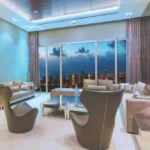 Raheja Imperia Worli 4 BHK Living Room With Sofa Chairs And Large Windows