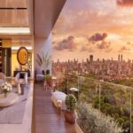 Piramal Aranya Byculla Balcony Seating Area With Chairs And Glass Railing