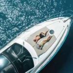 Hiranandani Sands Alibaug Couple Sunbathing on Speedboat