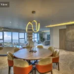 Salsette 27 Byculla Summit Residences Penthouse Living room with Round Dinner Table