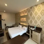 30 Room Hotel for Sale Majiwada Ghodbunder Road Thane West Deluxe Room with Wallpaper and Queen Bed