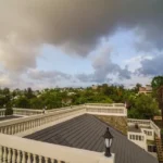 6 BHK Fully Furnished Villa Khandala Swimming Pool at Night Terrace View with Dark Clouds in Sky