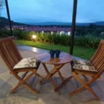 Kenisha Resort Villas Jambhulpada Khopoli Clubhouse with Lounge Chairs in Foreground