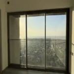 4 BHK Rustomjee Paramount Khar Bedroom Large Window Sunset View