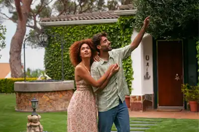 Young Couple Admiring the Foliage of their Second Homes