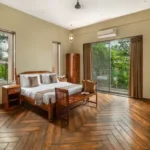 5 BHK Villa Khatri Park Lonavala Herringbone Floor Wall TV Bedroom