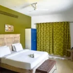 6 BHK Villa Deccan Hills Lokhandwala Complex Khandala Lonavala Green Accent Wall Blue Wardrobe Bedroom