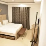 6 BHK Villa Deccan Hills Lokhandwala Complex Khandala Lonavala Grey Feature Wall Wooden Bed Bedroom