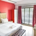 6 BHK Villa Deccan Hills Lokhandwala Complex Khandala Lonavala Red Feature Wall Sliding Doors Bedroom