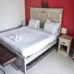 6 BHK Villa Deccan Hills Lokhandwala Complex Khandala Lonavala Wooden Headboard Red Accent Bedroom