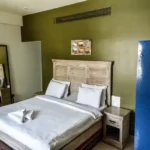 6 BHK Villa Deccan Hills Lokhandwala Complex Khandala Lonavala Green Feature Wall Wooden Bed Bedroom