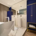 Embassy Citadel Worli Mumbai 3 BHK Freestanding Bathtub Blue Cabinets Bathroom