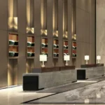 Thakker Group Sea Face House Worli Backlit Shelving Stone Counter Concierge Desk