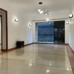 3.5 BHK Windermere Andheri West Living Room With Empty Floor And Sliding Balcony Doors