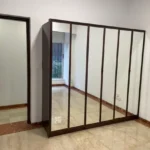 3.5 BHK Windermere Andheri West Bedroom With Mirror Wardrobe And Doorway