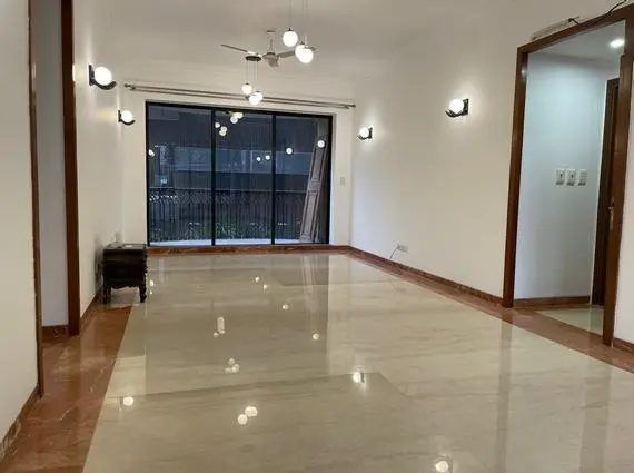 3.5 BHK Windermere Andheri West Living Room With Polished Floor And Balcony Doors