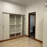 3.5 BHK Windermere Andheri West Bedroom With Storage Cabinets And Open Shelves