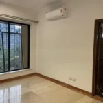 3.5 BHK Windermere Andheri West Bedroom With Window Grill And Bathroom Door