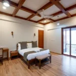 4 BHK Villa Agarsure Alibaug Bedroom With Bed Facing Balcony Doors