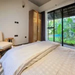 4 BHK Villa Siolim Bardez North Goa Bedroom With Bed Facing Glass Garden Doors