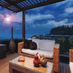 60 Perry Cross Bandra West Wicker Sofa With Glass Railing Terrace