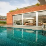 La Sierra Vagator Villa Terrace With Chairs And Potted Plants