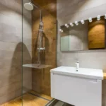Purva Clermont Chembur Bathroom With Wash Basin Vanity Mirror Lights Glass Shower And Wall Tiles