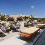 Romell Asrava Andheri West Terrace Area With Hanging Chairs And Day Beds