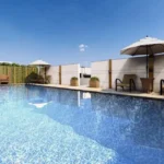 Romell Asrava Andheri West Rooftop Swimming Pool With Lounge Chairs