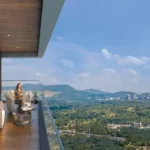Sunteck Altavia Goregaon West Balcony With Glass Railing And Forest View