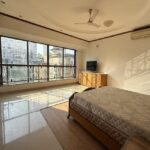4 BHK United Classic Penthouse Duplex Mount Mary Bandstand Bandra Bedroom With Bed Facing Large Windows