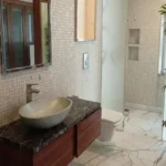 5 BHK Duplex Oberoi Sky Heights Andheri West Bathroom With Basin Mirror And Cabinet