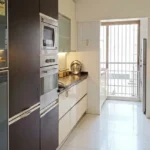 5 BHK Duplex Oberoi Sky Heights Andheri West Kitchen With White Cabinets And Countertop