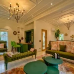 Neel Moira North Goa 5 BHK Elegant Living Room With Sofa Seating And Chandelier