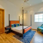 Neel Moira North Goa 5 BHK Luxury Bedroom With Four Poster Bed And Seating