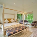Neel Moira North Goa 5 BHK Luxury Bedroom With Canopy Bed And Window Seating Area