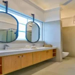 Neel Moira North Goa 5 BHK Elegant Bathroom With Mirror Vanity And Modern Sink
