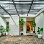 Neel Moira North Goa 5 BHK Luxury Villa Entrance Courtyard With Pergola And Plants