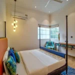 Neel Moira North Goa 5 BHK Modern Bedroom Interior With Bed Window Seating And Desk
