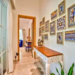 Neel Moira North Goa 5 BHK Interior Hallway With Wall Art And Decorative Console Table
