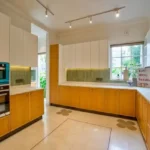 Neel Moira North Goa 5 BHK Kitchen Area With Built In Oven Cabinets And Island Counter