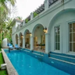 Neel Moira North Goa 5 BHK Private Swimming Pool With Arched Veranda And Lounge Chairs