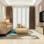 1 BHK 2 BHK La Wisteria Siolim North Goa Elegant Living Room Interior With Designer Sofa Coffee Table And Television Wall