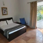 3 BHK Villa In Gondhalpada Alibaug Bright Bedroom With Balcony And Outdoor Seating