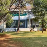 3 BHK Villa In Gondhalpada Alibaug Modern Bungalow With Large Garden And Glass Windows